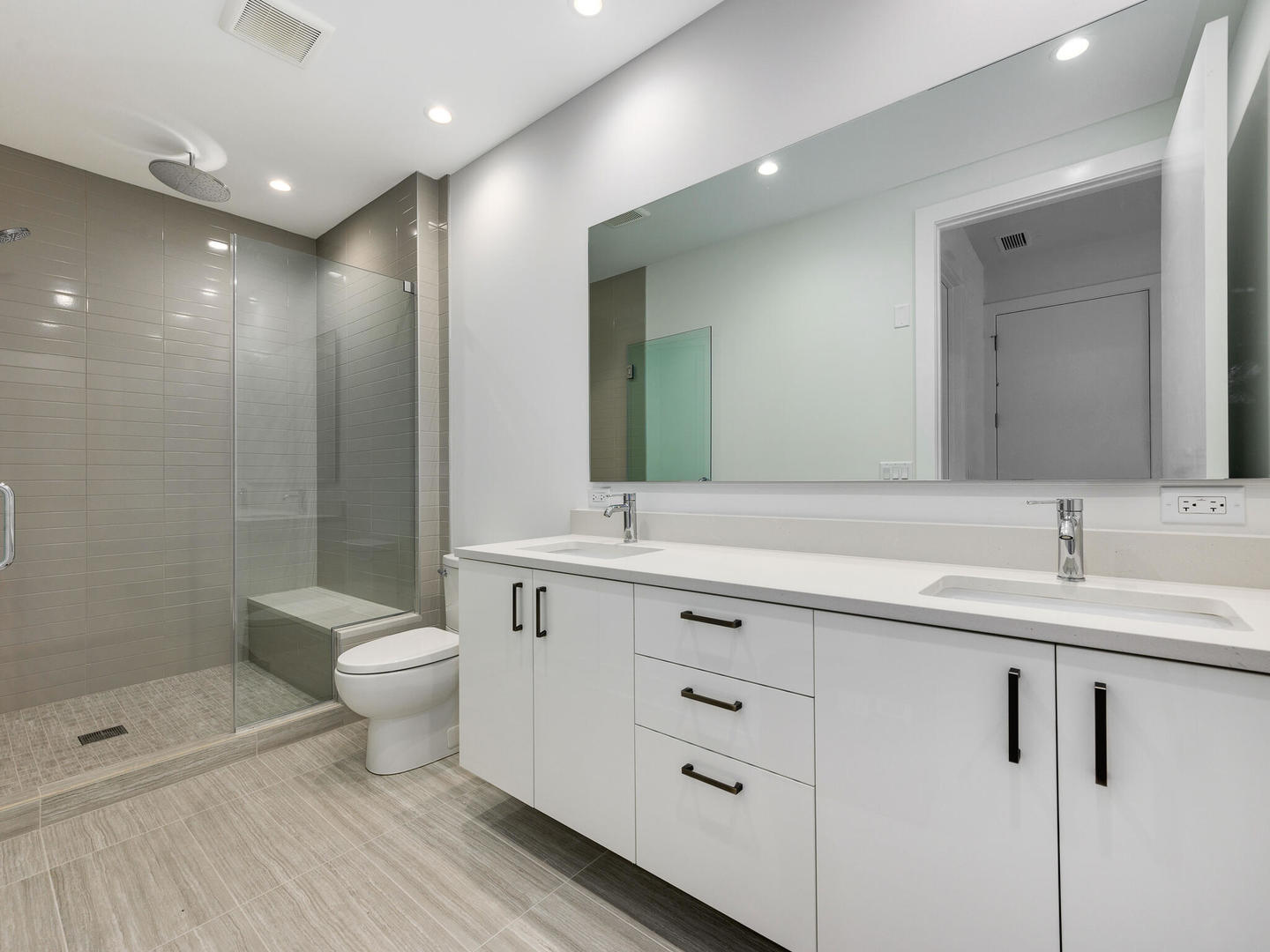 1701 West Webster Avenue, Unit 312 Chicago, IL 60614 - Photo 11 of 19 a bathroom with a toilet a sink and a mirror