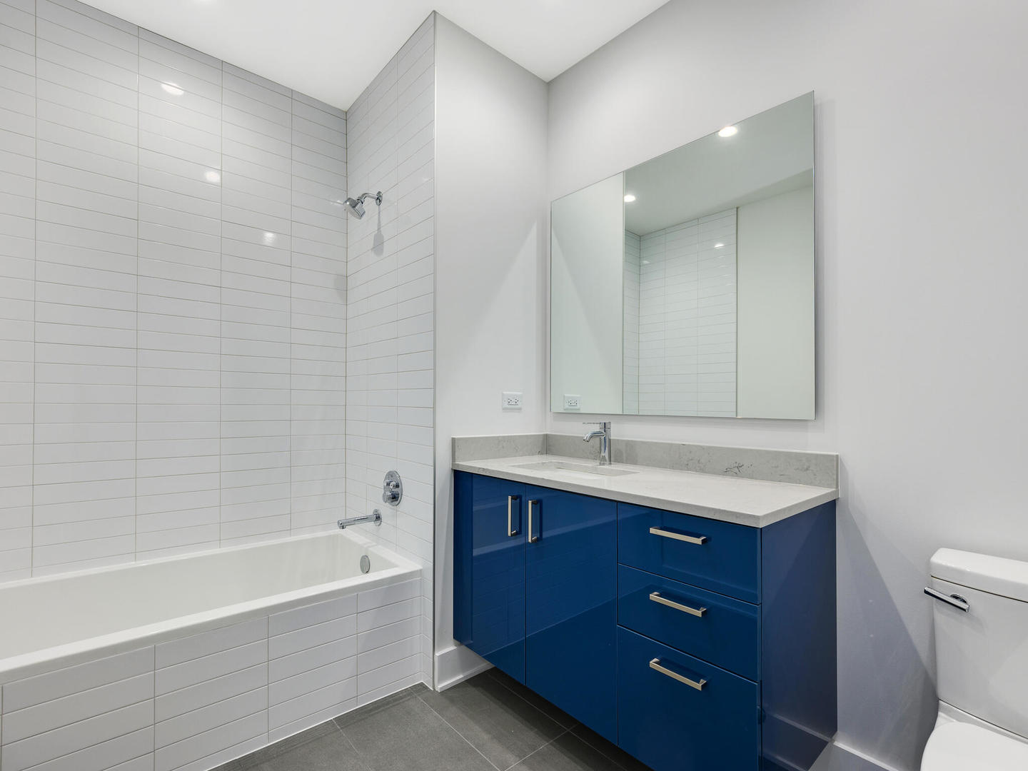 1701 West Webster Avenue, Unit 312 Chicago, IL 60614 - Photo 16 of 19 a bathroom with a tub sink and mirror