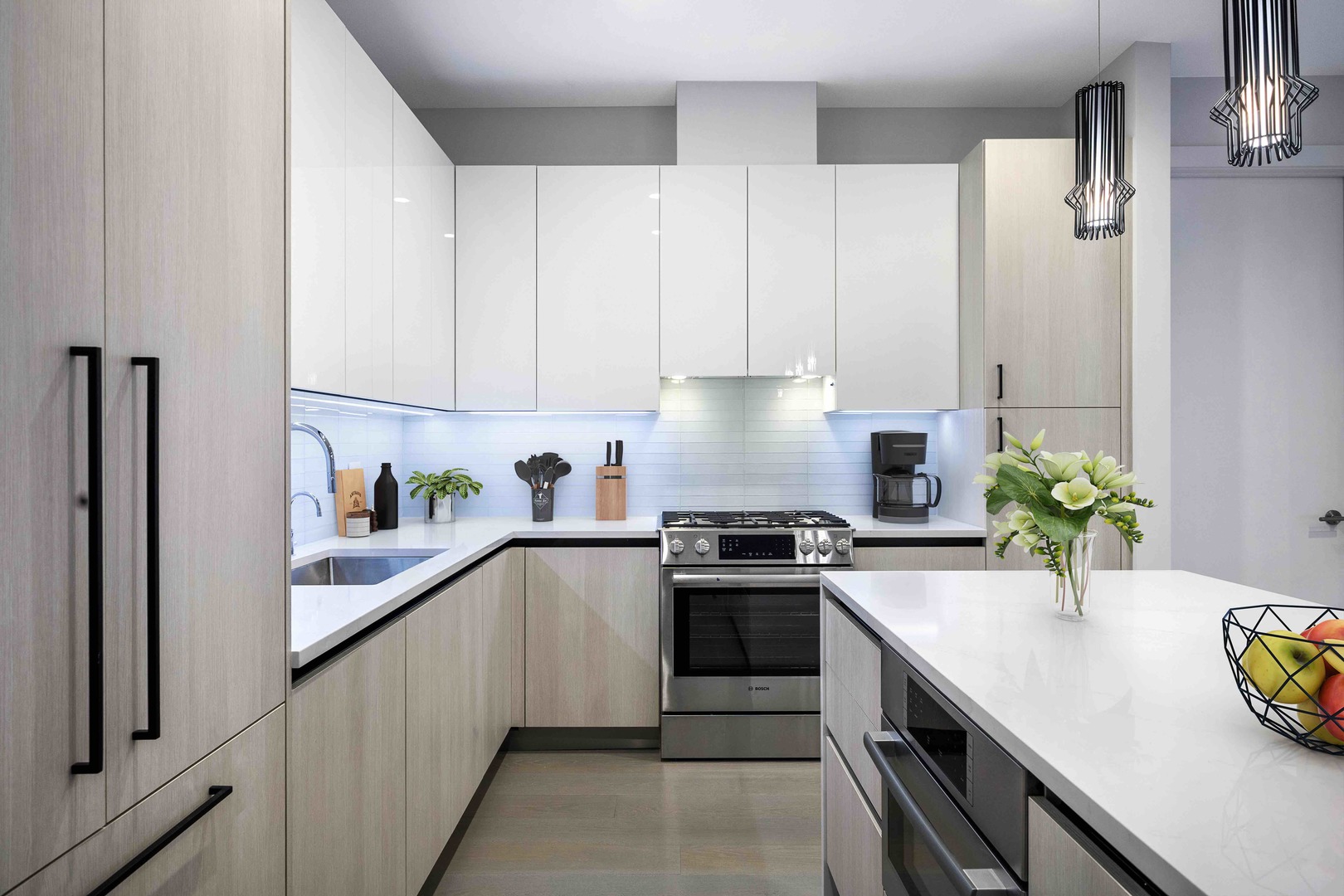 1701 West Webster Avenue, Unit 312 Chicago, IL 60614 - Photo 3 of 19 a kitchen with stainless steel appliances a sink a stove and a refrigerator