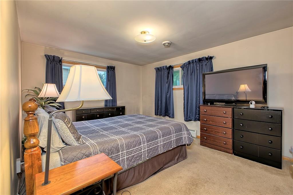 1119 Church Street Indiana, PA 15701 - Photo 14 of 34 a bedroom with a bed and a flat screen tv