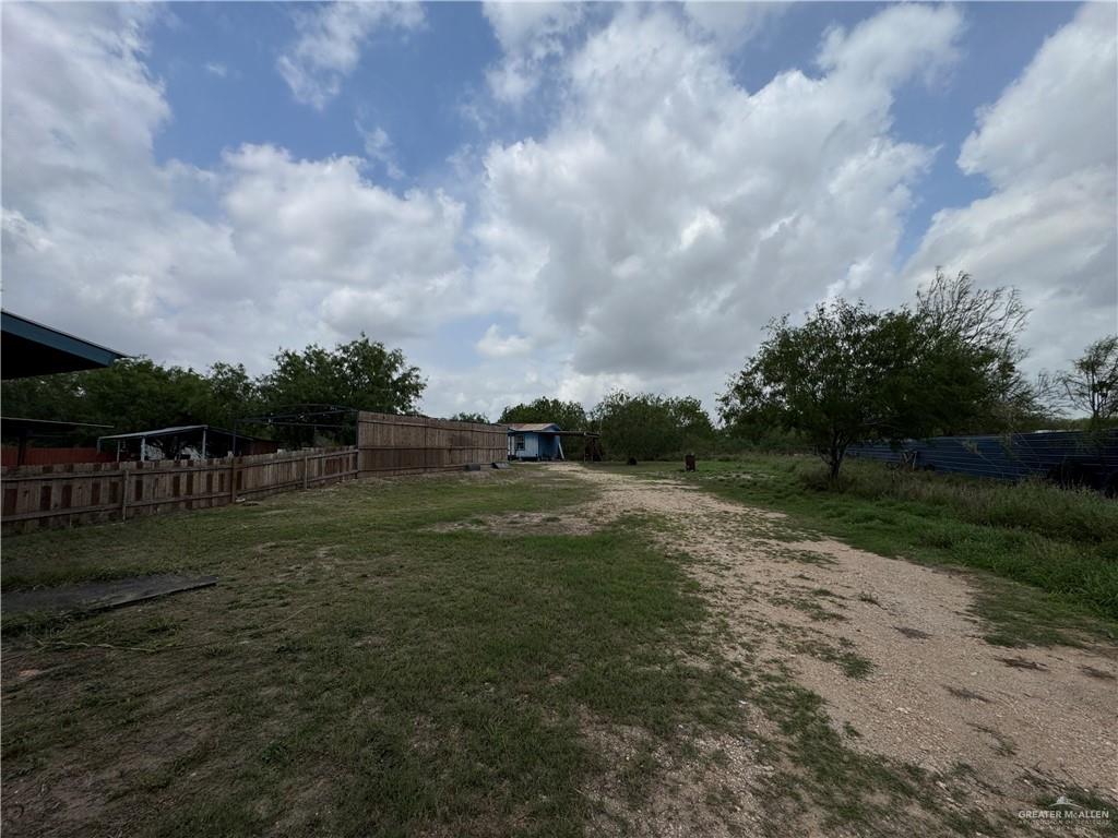 11235 North Moorefield Road Mission, TX 78574 - Photo 14 of 22 a view of grassy field with wooden fence