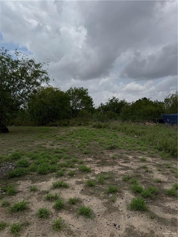 11235 North Moorefield Road Mission, TX 78574 - Photo 19 of 22 a view of a field with an trees in the background