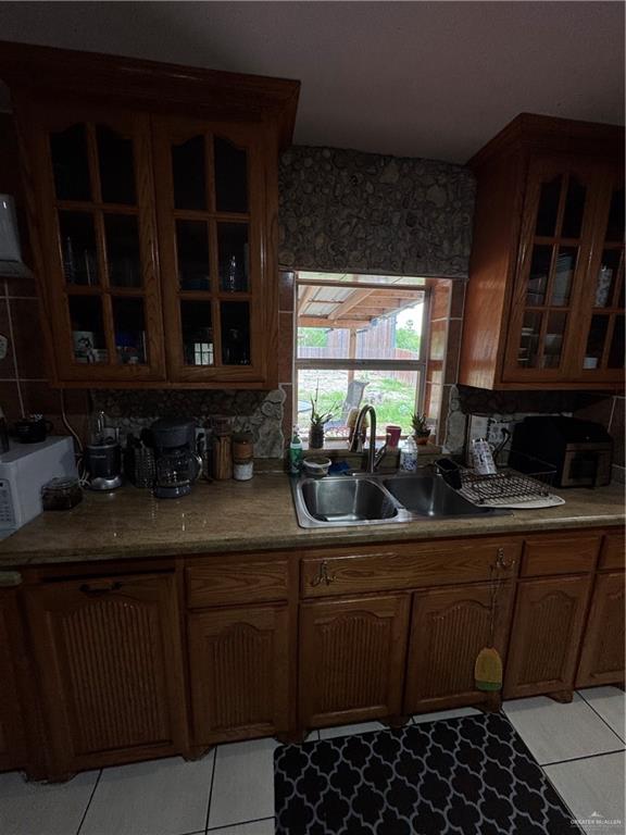 11235 North Moorefield Road Mission, TX 78574 - Photo 4 of 22 a kitchen with a sink and a stove