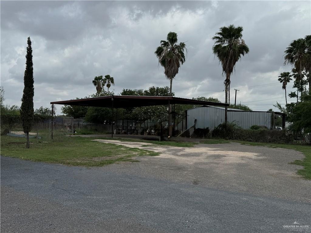 11235 North Moorefield Road Mission, TX 78574 - Photo 10 of 22 a view of a fountain in front of a house with a yard