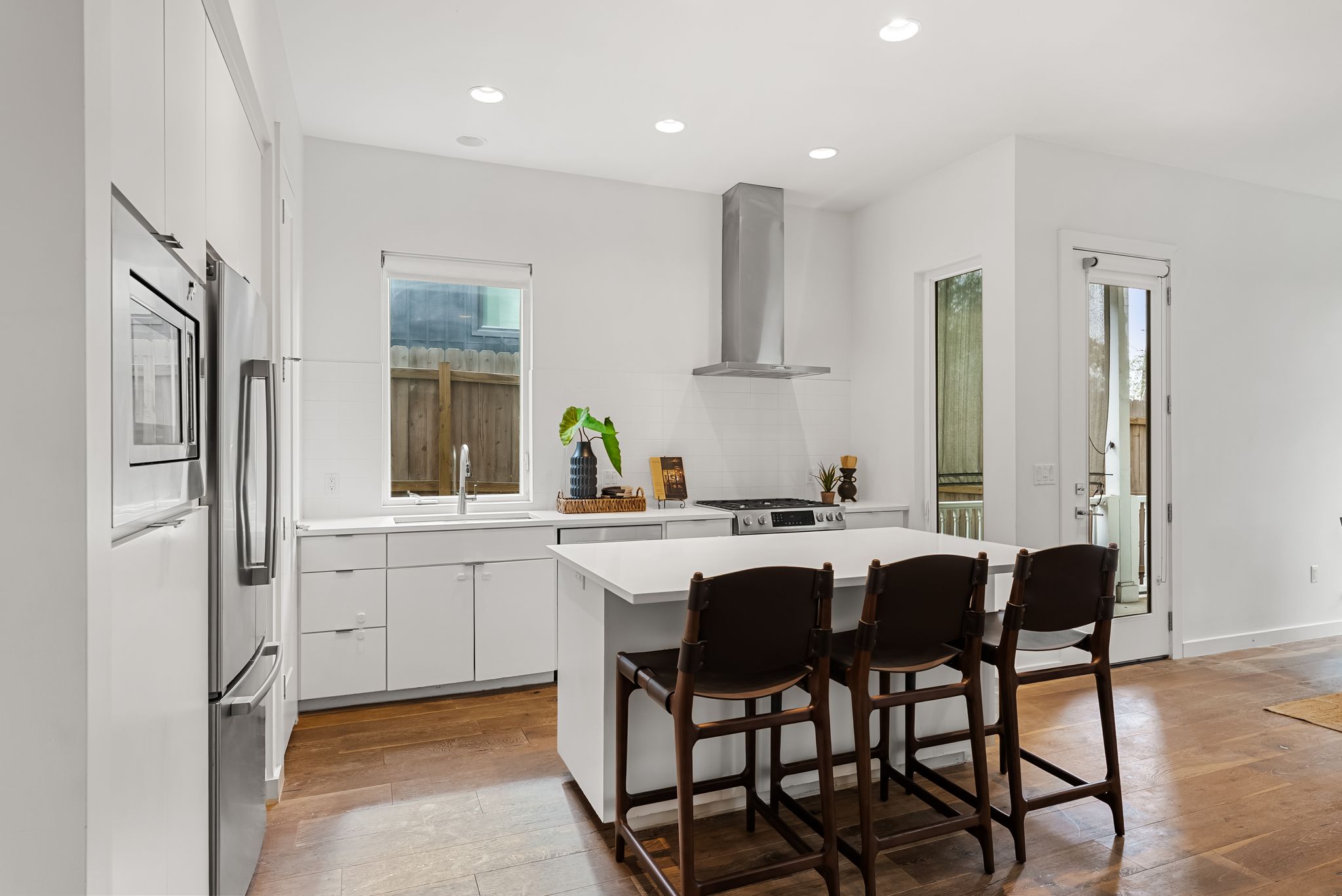 3812 Wadford Street, Unit A Austin, TX 78704 - Photo 12 of 37 Kitchen featuring an island with seating for three.
