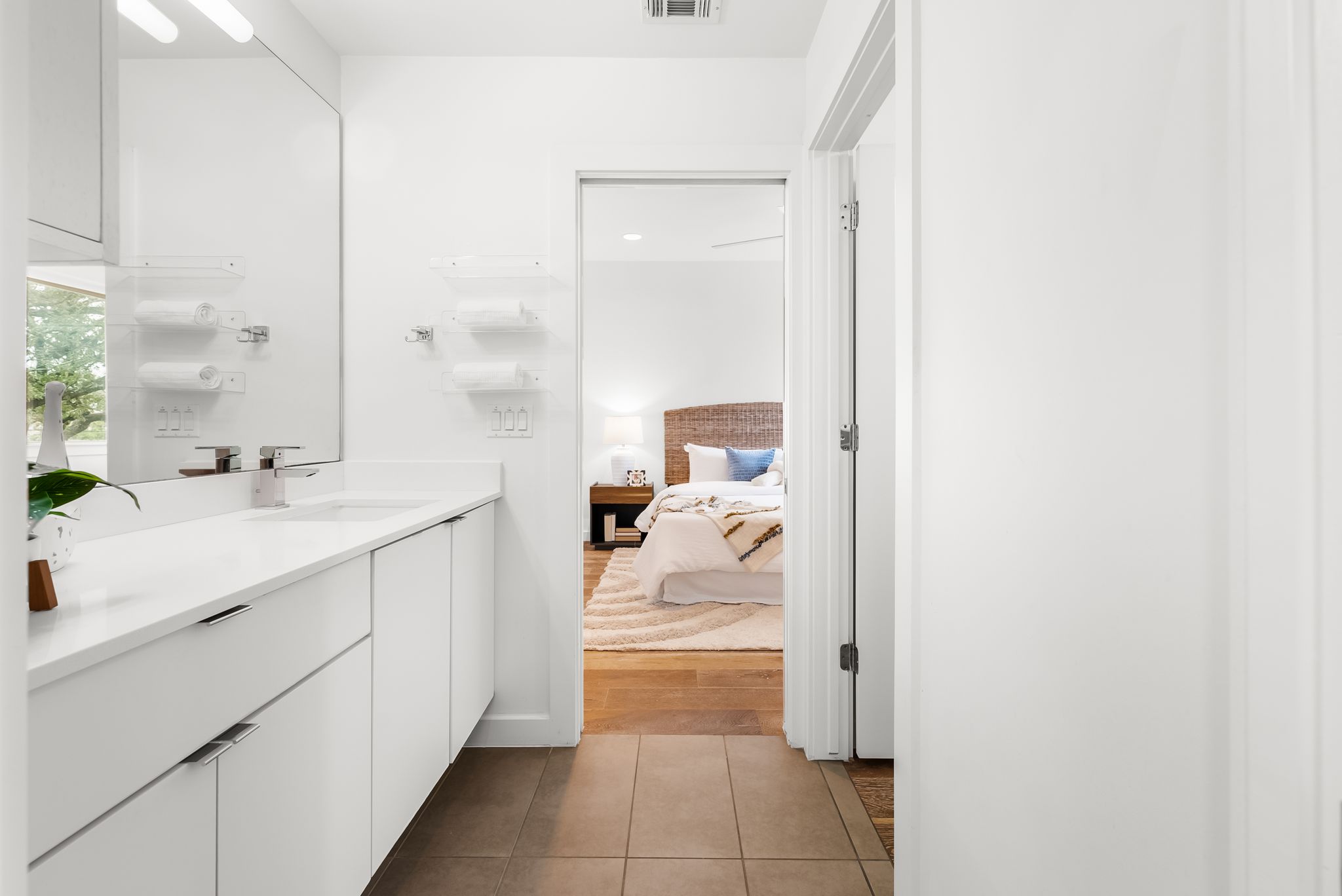 3812 Wadford Street, Unit A Austin, TX 78704 - Photo 20 of 37 Ensuite bathroom featuring large mirror and custom vanity