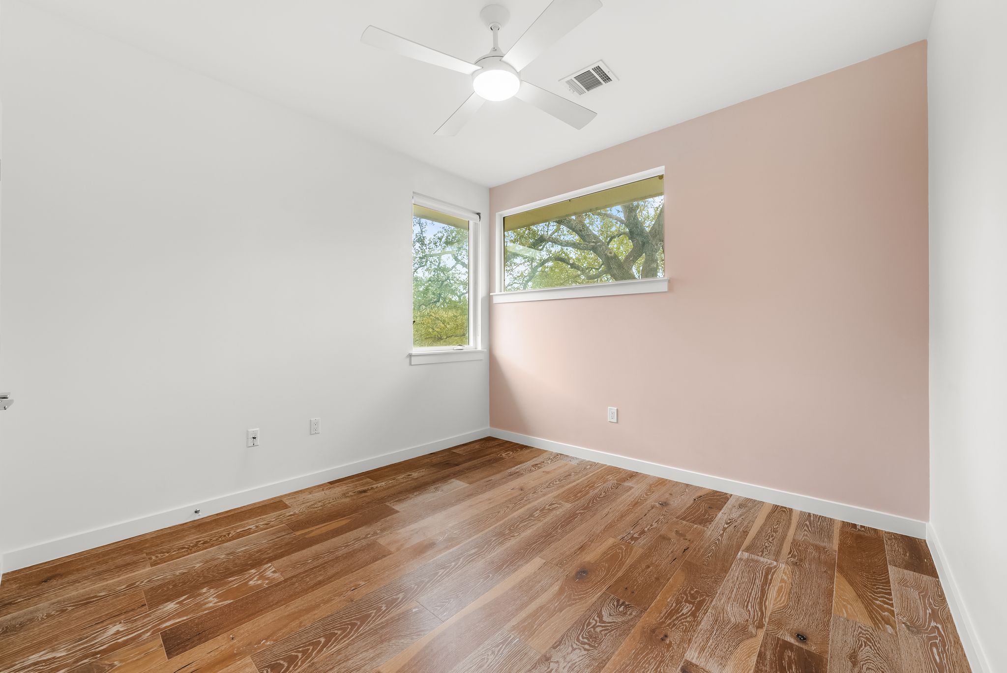 3812 Wadford Street, Unit A Austin, TX 78704 - Photo 26 of 37 Wood floors and windows in the treetops