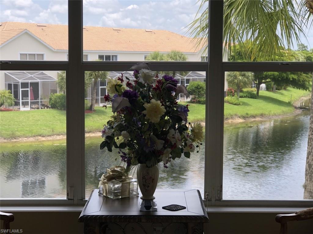 1380 Tiffany Lane, Unit 2204 Naples, FL 34105 - Photo 15 of 29 a view of a lake from a window