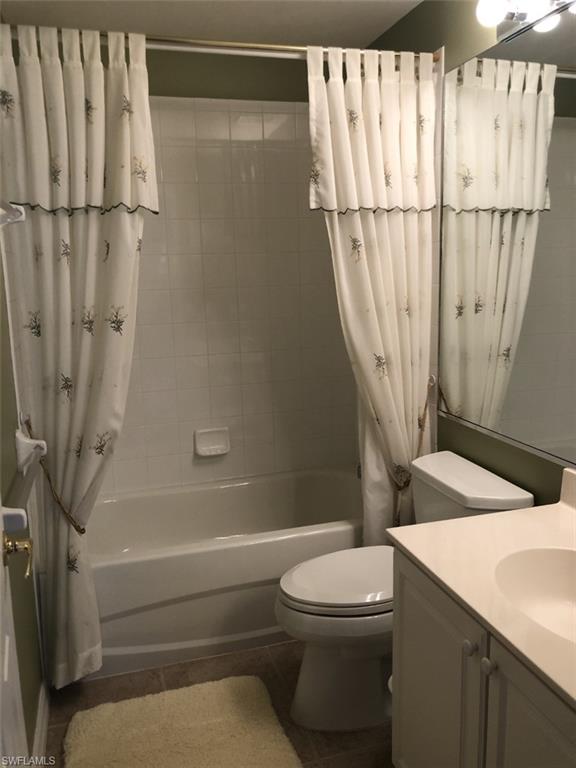 1380 Tiffany Lane, Unit 2204 Naples, FL 34105 - Photo 26 of 29 a bathroom with a sink a toilet and shower