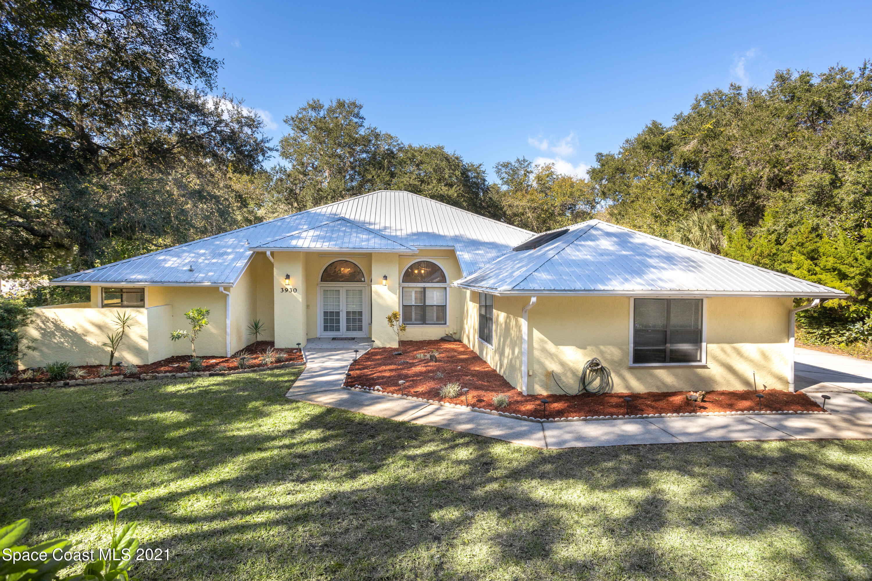 3930 Hammock Road Mims, FL 32754 - Photo 1 of 28 a view of a house with a yard