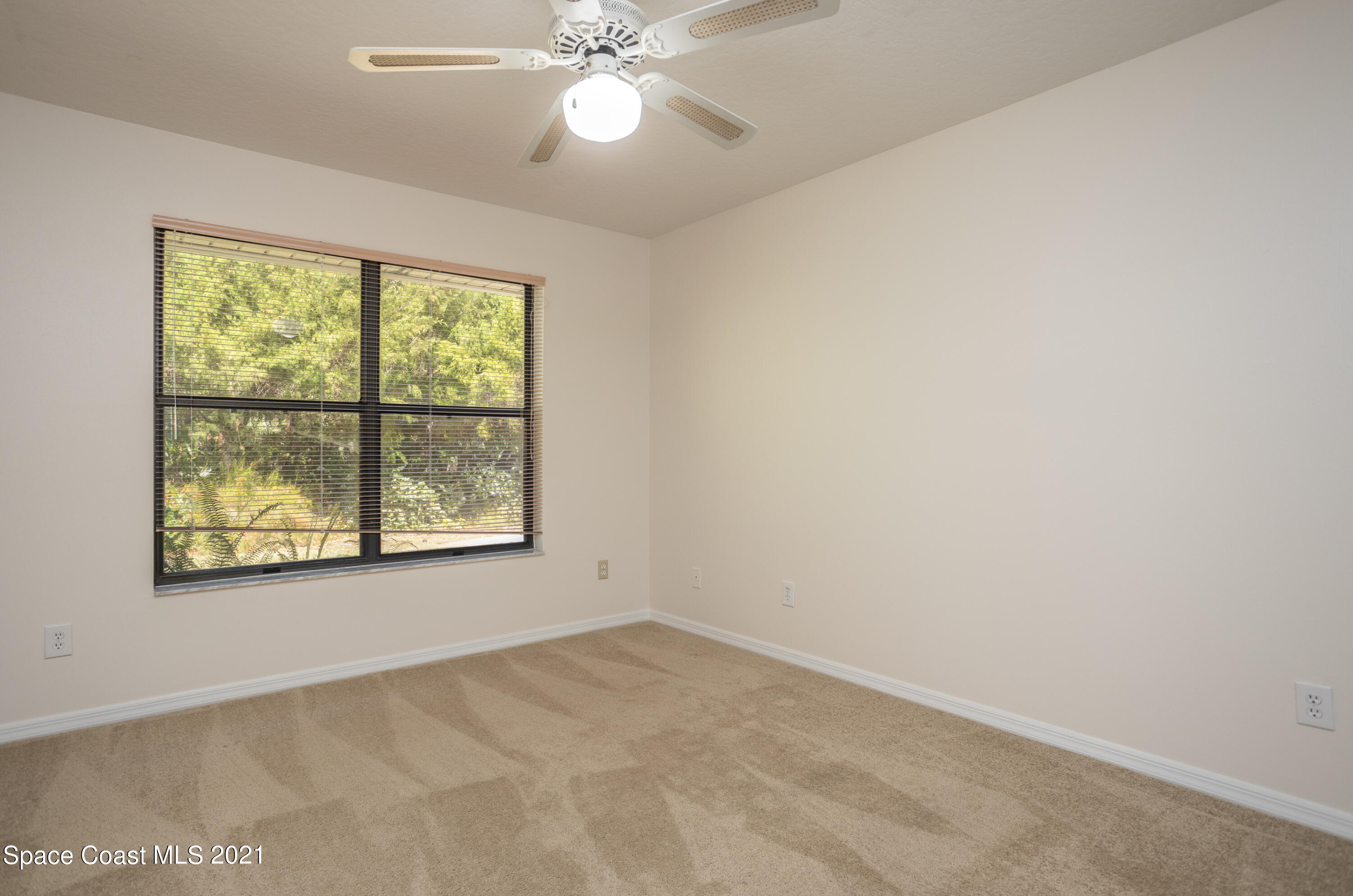 3930 Hammock Road Mims, FL 32754 - Photo 15 of 28 an empty room with a window
