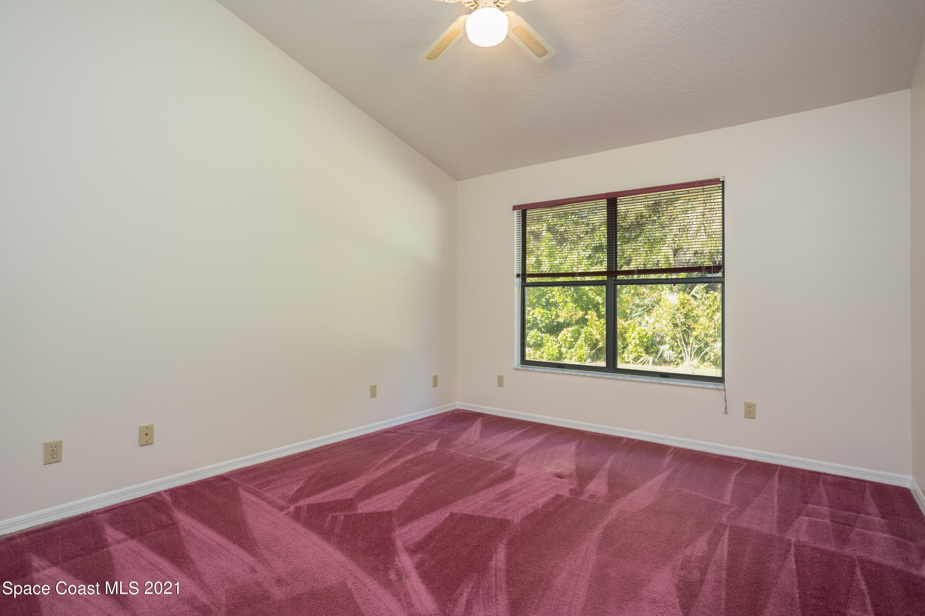 3930 Hammock Road Mims, FL 32754 - Photo 16 of 28 an empty room with a window