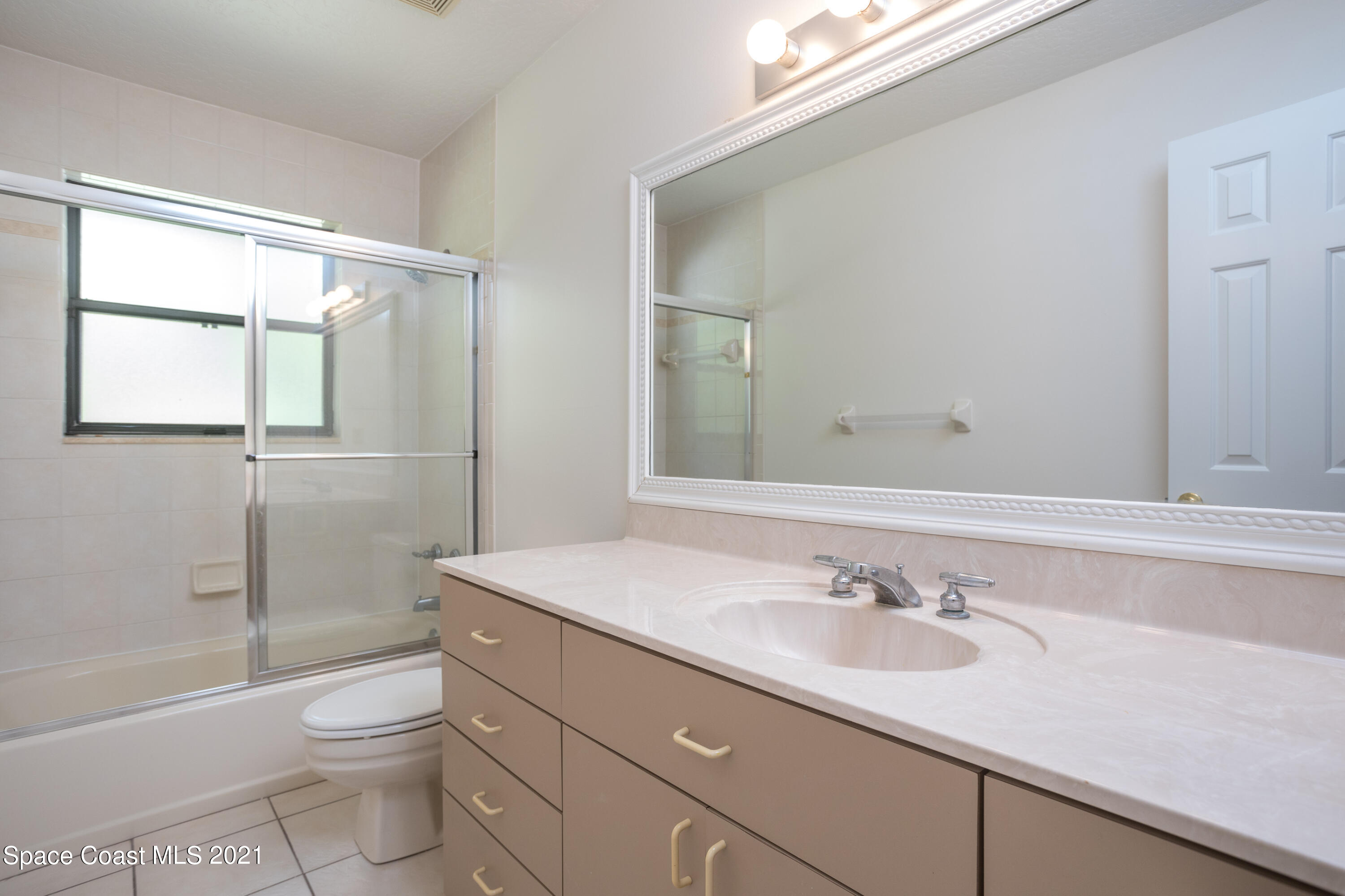 3930 Hammock Road Mims, FL 32754 - Photo 17 of 28 a bathroom with a sink a toilet and shower
