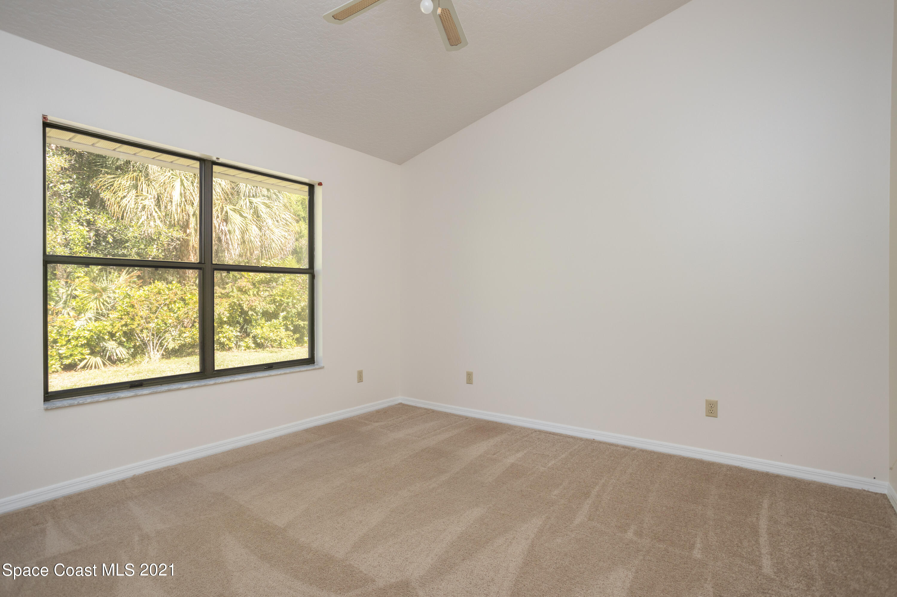 3930 Hammock Road Mims, FL 32754 - Photo 18 of 28 an empty room with a window