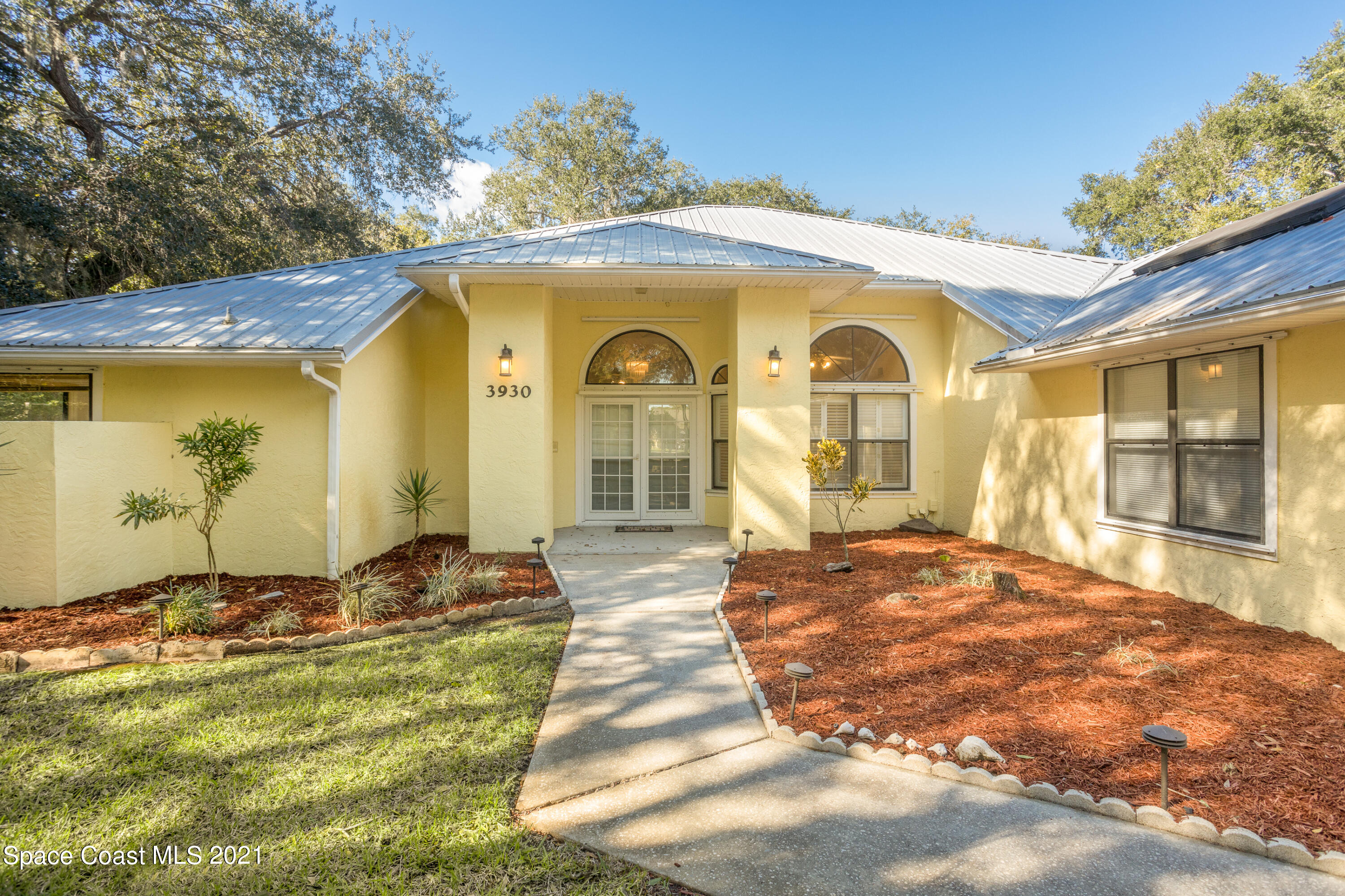 3930 Hammock Road Mims, FL 32754 - Photo 2 of 28 a front view of a house