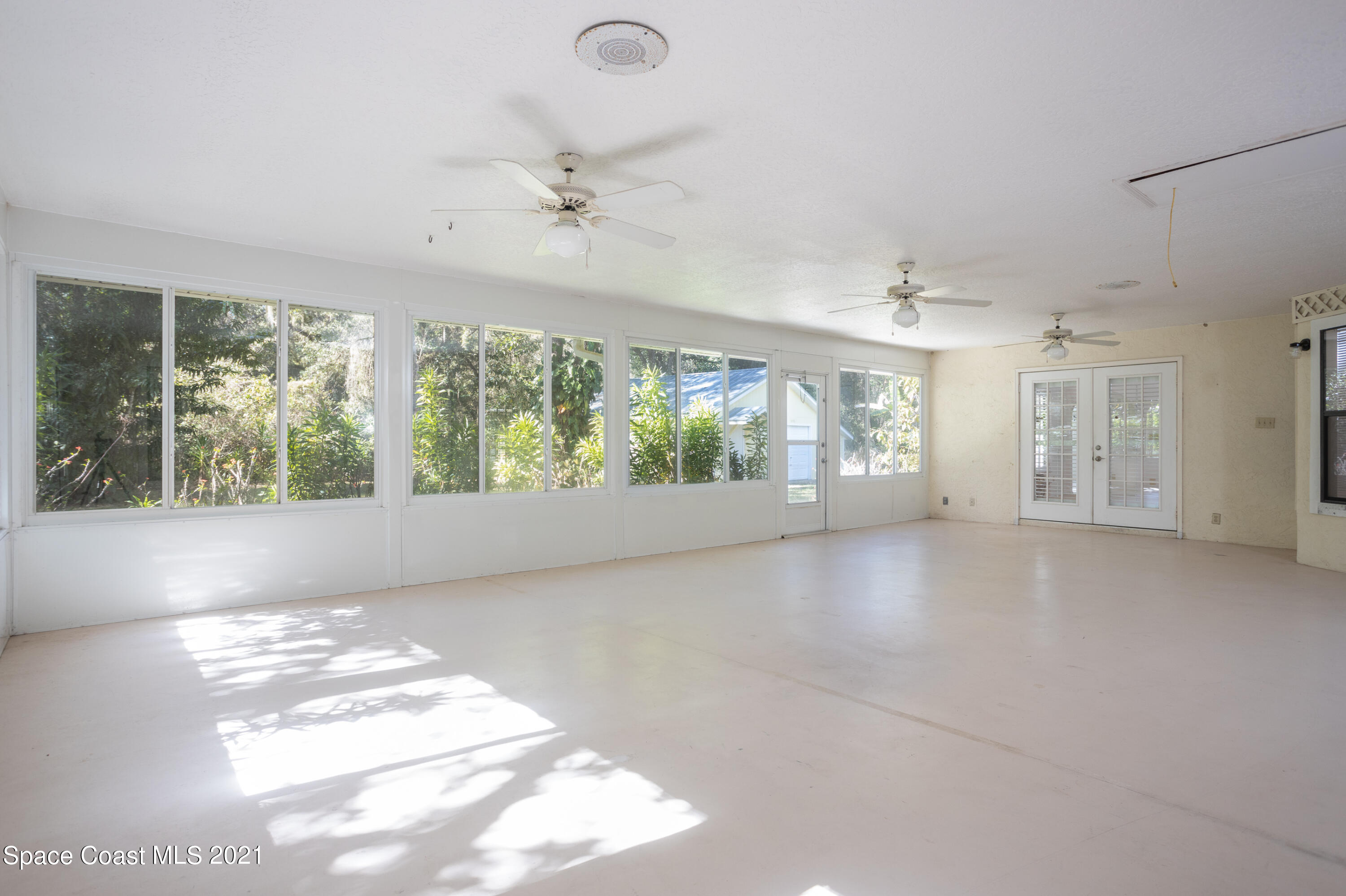 3930 Hammock Road Mims, FL 32754 - Photo 21 of 28 a view of an empty room with a window