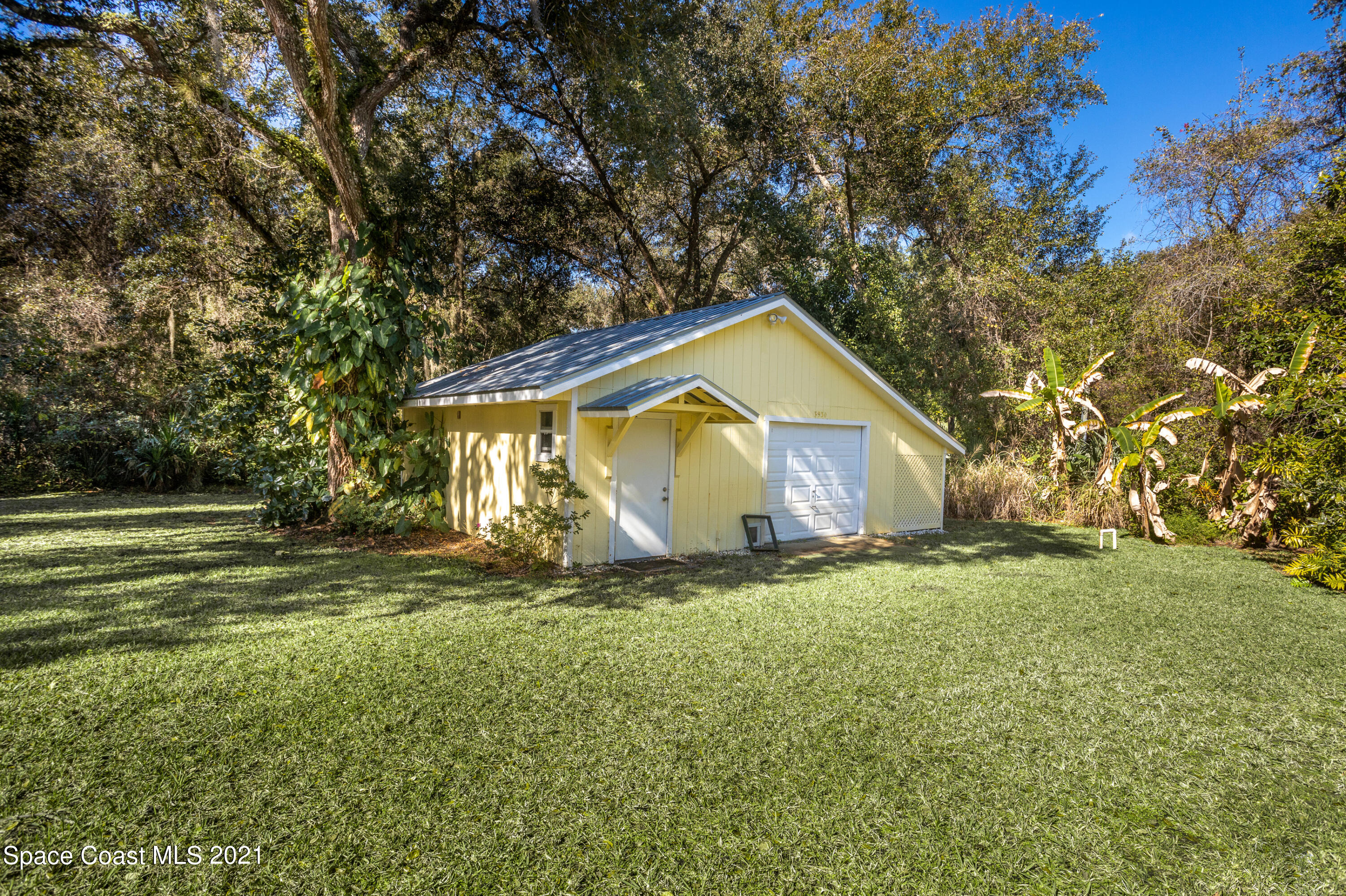 3930 Hammock Road Mims, FL 32754 - Photo 26 of 28 a house with huge green field