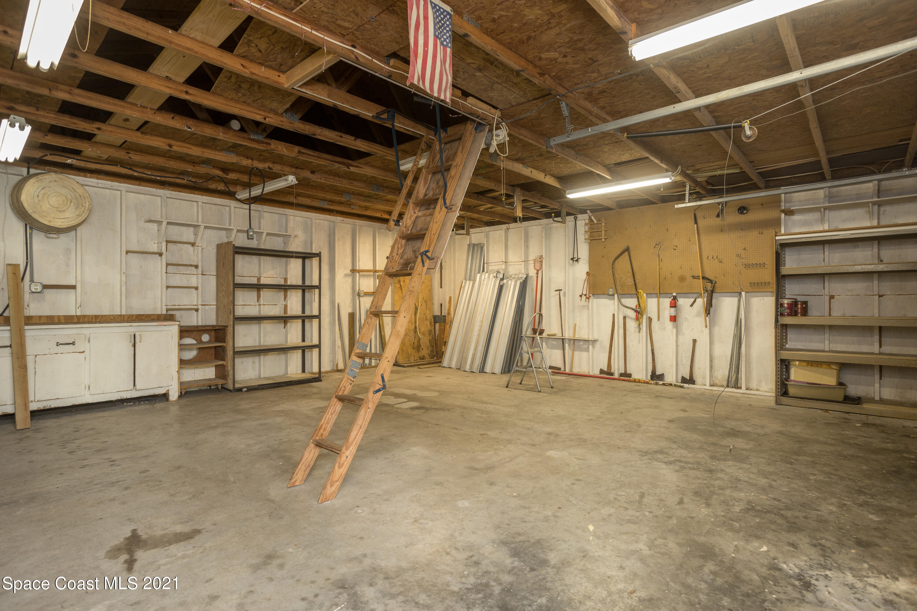 3930 Hammock Road Mims, FL 32754 - Photo 27 of 28 a view of an empty room with storage