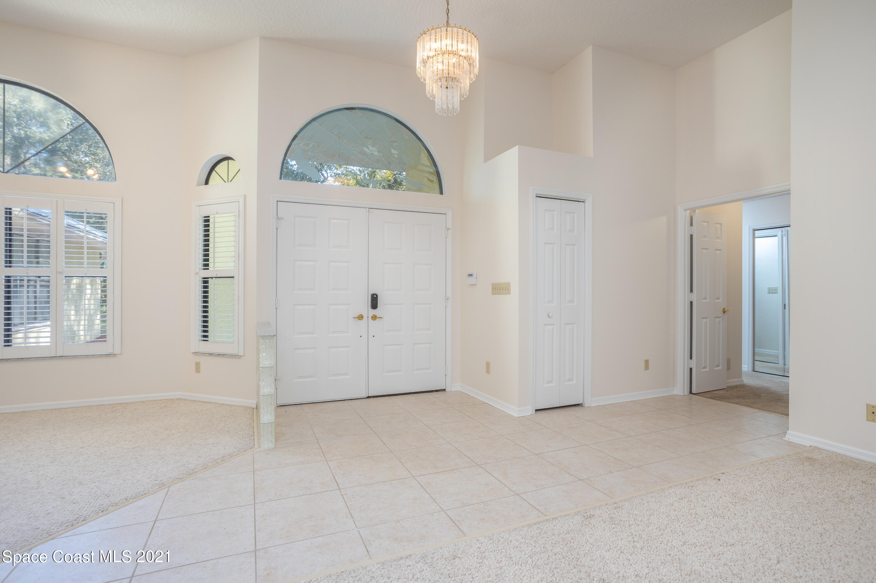 3930 Hammock Road Mims, FL 32754 - Photo 3 of 28 a view of an empty room with a window