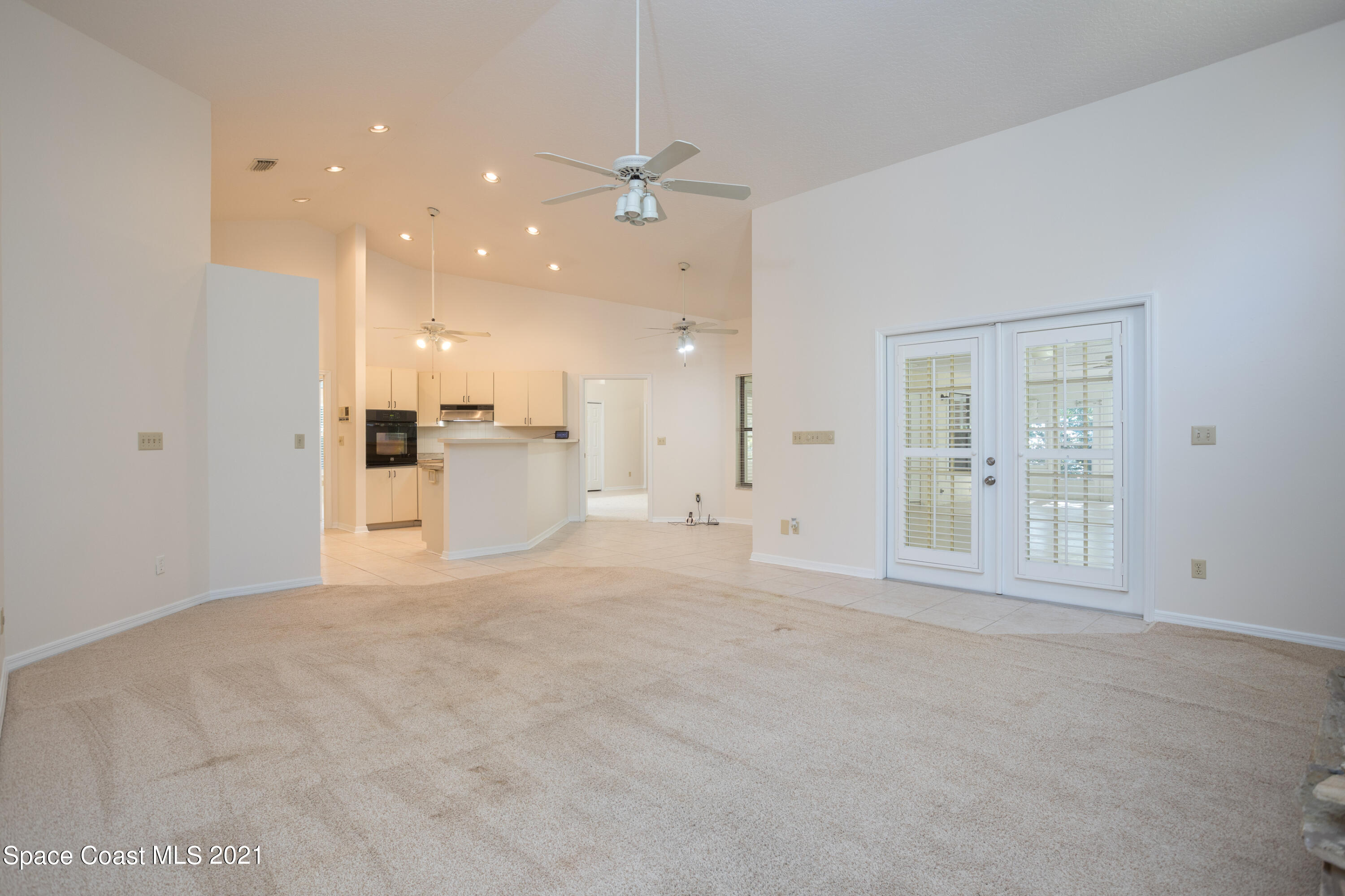3930 Hammock Road Mims, FL 32754 - Photo 7 of 28 a view of an empty room with a kitchen