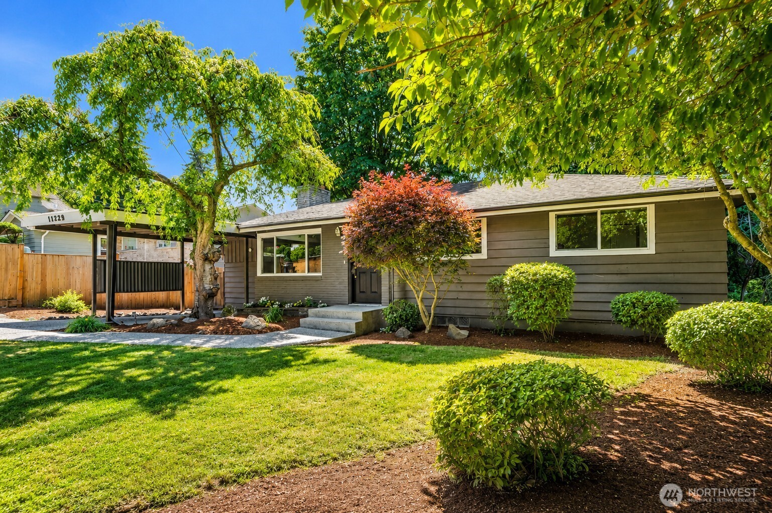 11229 29th Avenue Southwest Seattle, WA 98146 - Photo 2 of 28 a view of a house with backyard and sitting area