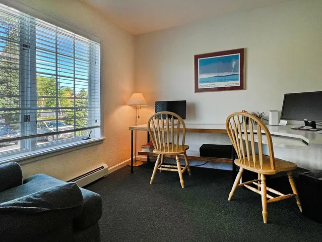 a dining room with furniture and windows