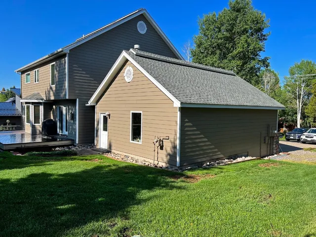a view of backyard with a garden and entertaining space