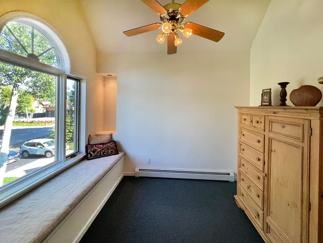 a room with furniture and a large window