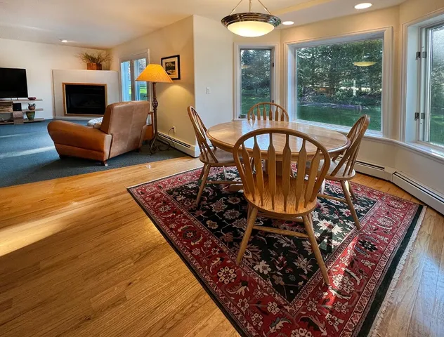 a living room with furniture and a rug