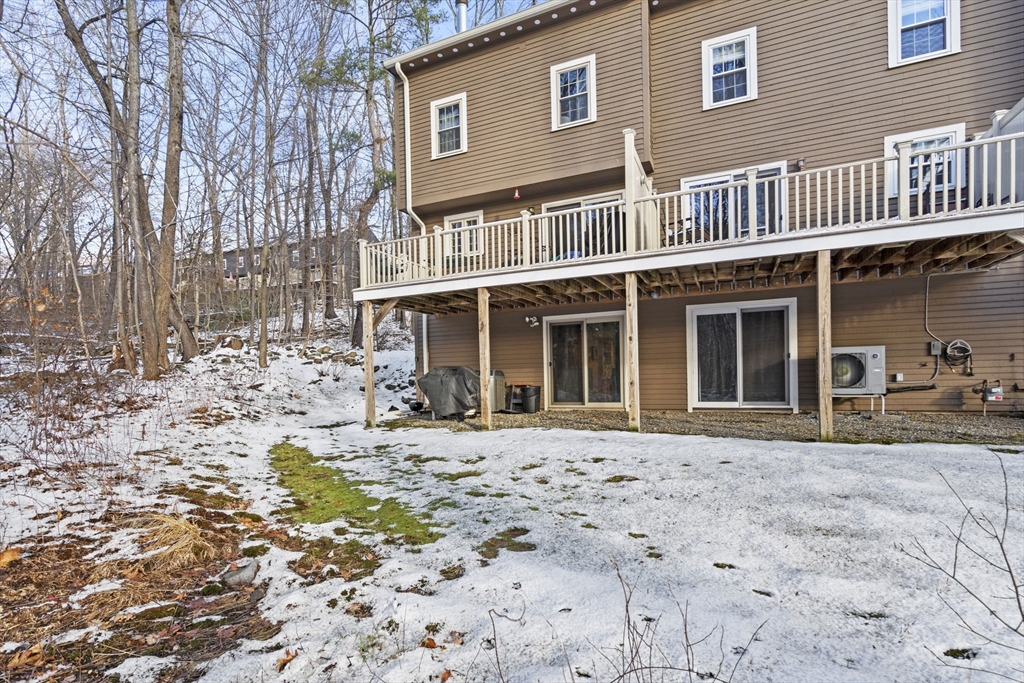 4 Apple Ridge Road, Unit 6 Maynard, MA 01754 - Photo 31 of 40 a front view of a house with a yard