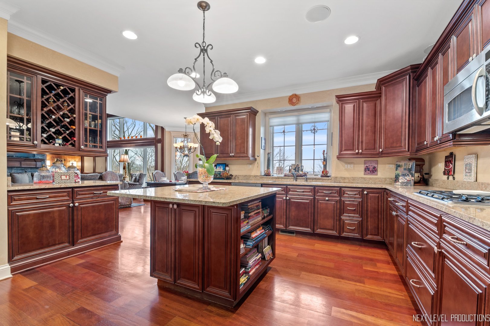 1787 Rizzi Lane Bartlett, IL 60103 - Photo 14 of 47 a large kitchen with stainless steel appliances granite countertop a stove and large cabinets