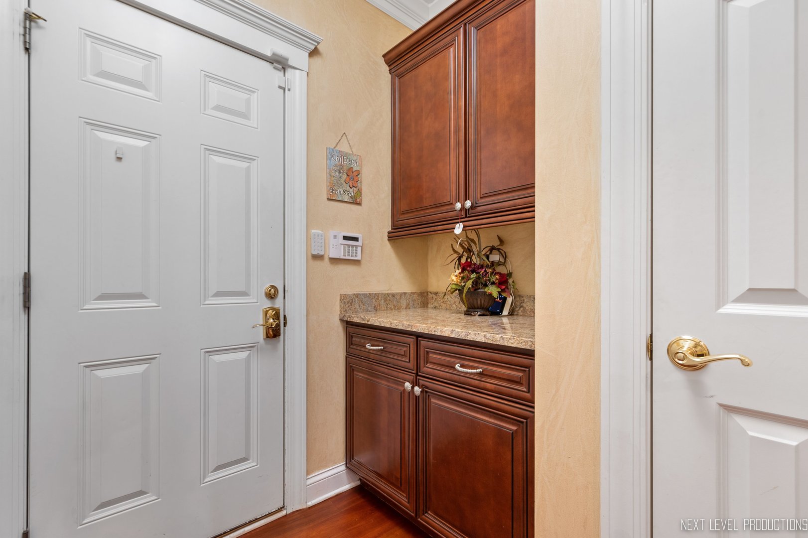 1787 Rizzi Lane Bartlett, IL 60103 - Photo 15 of 47 a kitchen with a refrigerator and cabinets