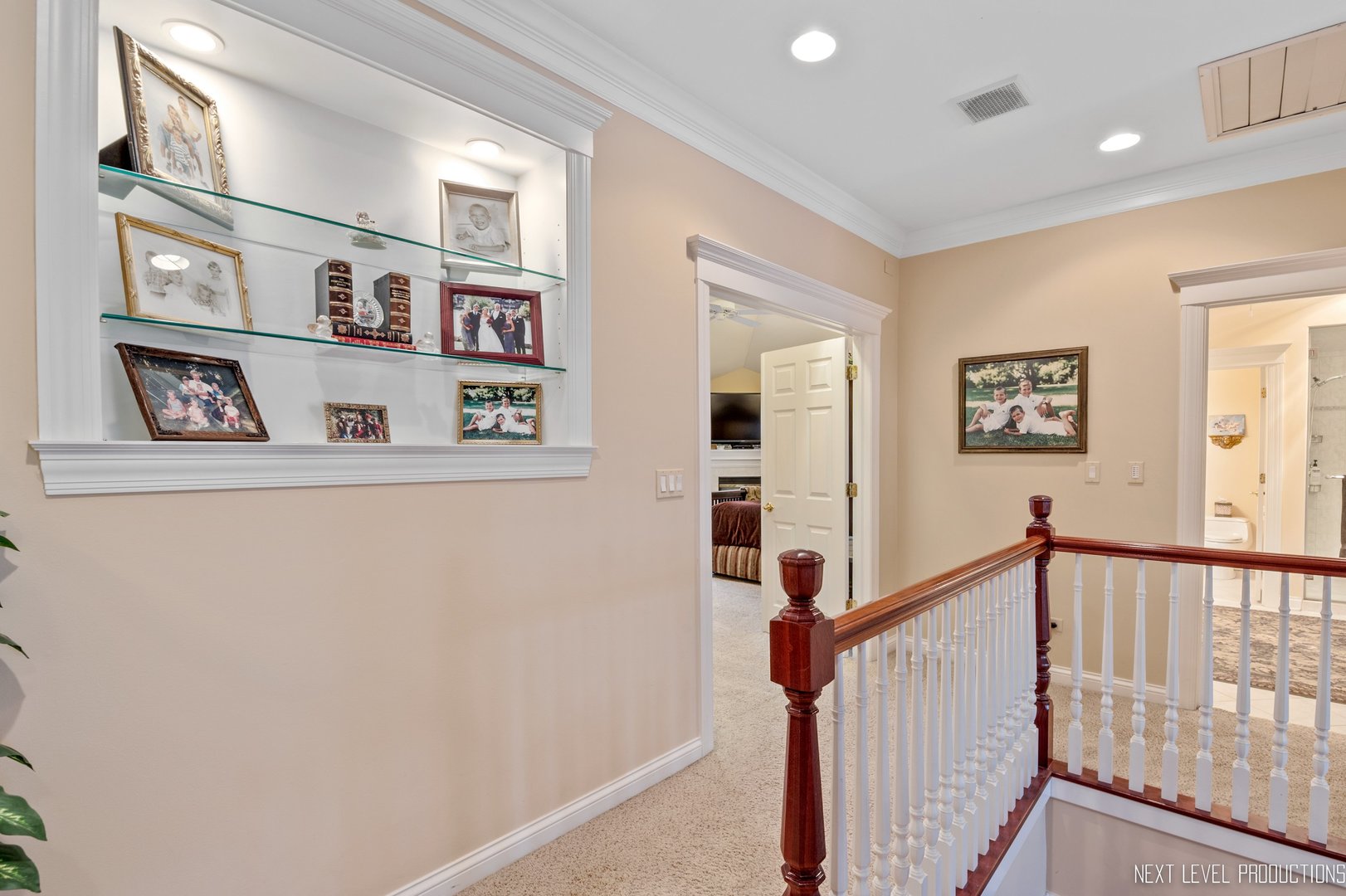 1787 Rizzi Lane Bartlett, IL 60103 - Photo 17 of 47 a view of a hallway with paintings on the wall