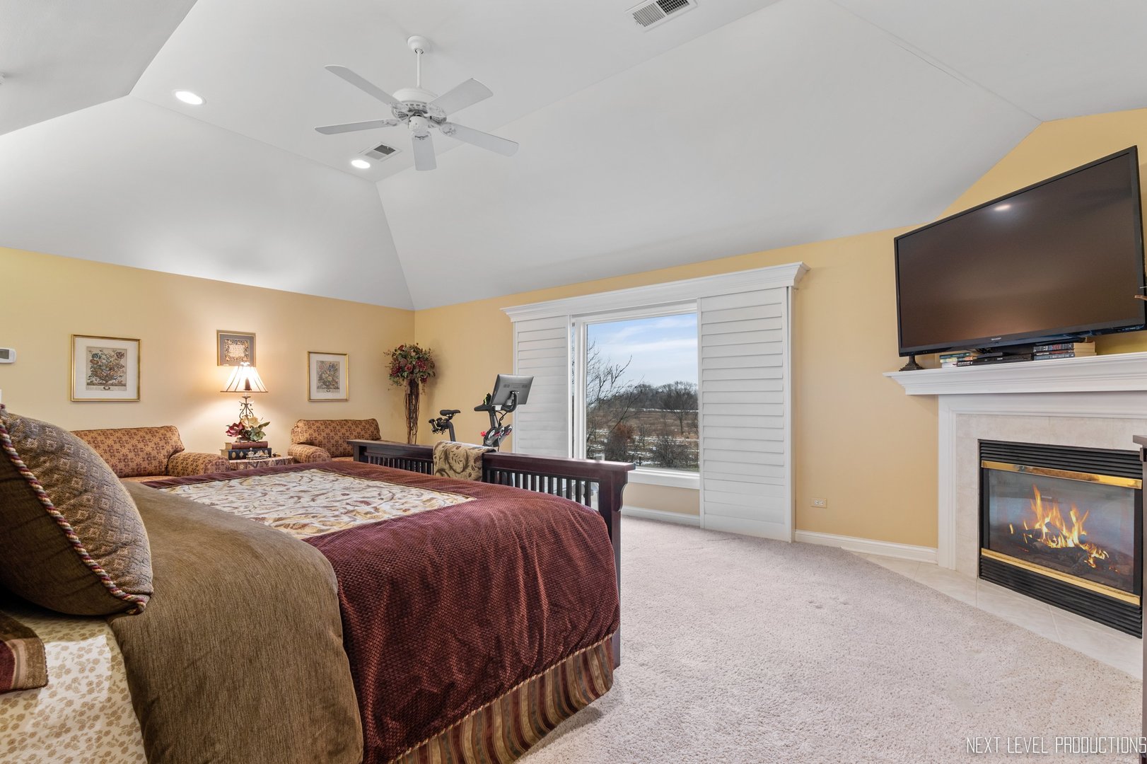 1787 Rizzi Lane Bartlett, IL 60103 - Photo 20 of 47 a spacious bedroom with a bed and a flat screen tv