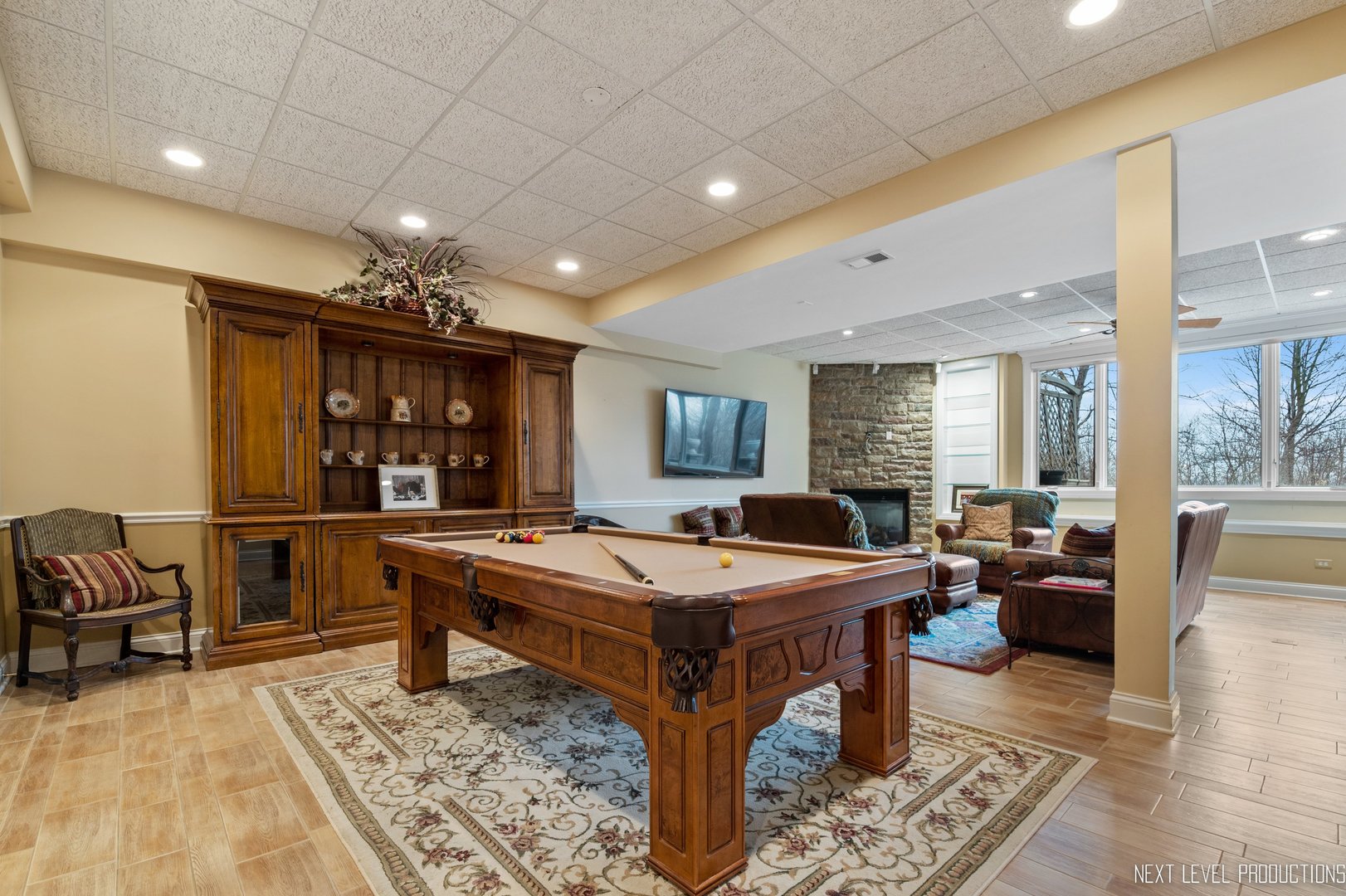 1787 Rizzi Lane Bartlett, IL 60103 - Photo 29 of 47 a dining hall with couches a table and chairs with wooden floor