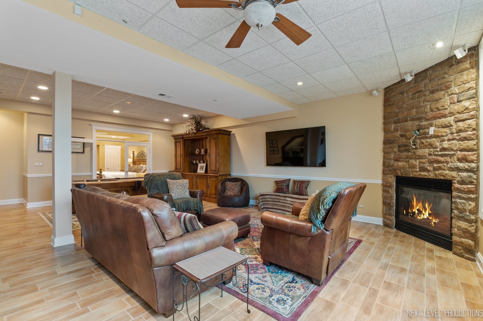 1787 Rizzi Lane Bartlett, IL 60103 - Photo 30 of 47 a living room with furniture and a fireplace