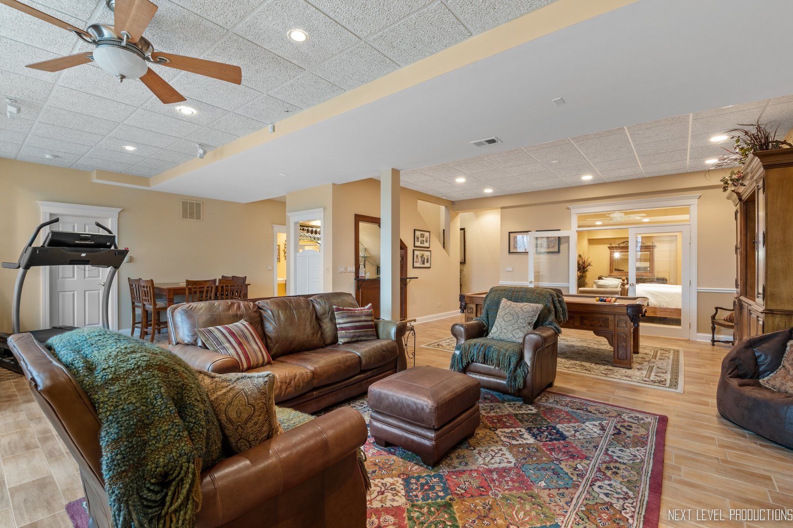 1787 Rizzi Lane Bartlett, IL 60103 - Photo 31 of 47 a living room with furniture a ceiling fan and a rug