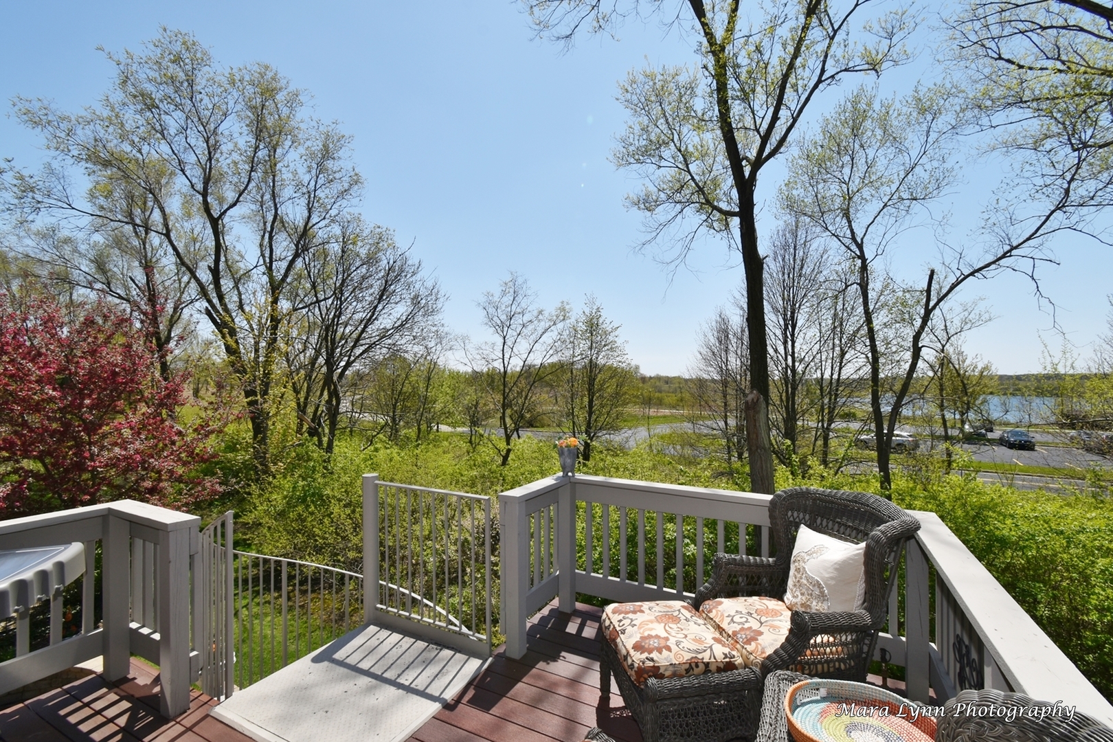 1787 Rizzi Lane Bartlett, IL 60103 - Photo 38 of 47 a view of a deck with couches table and chairs with wooden floor and fence