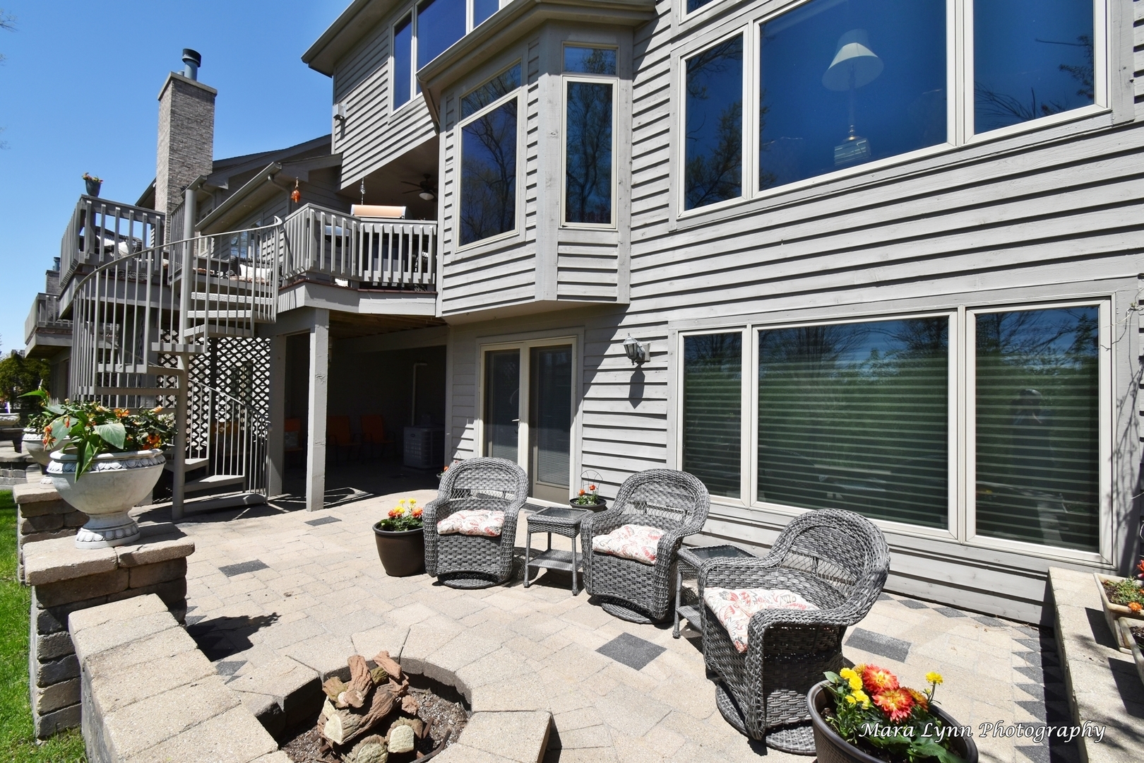 1787 Rizzi Lane Bartlett, IL 60103 - Photo 39 of 47 a view of a patio with couches table and chairs and potted plants