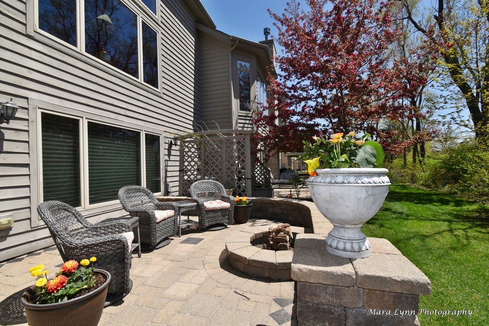 1787 Rizzi Lane Bartlett, IL 60103 - Photo 41 of 47 a view of a patio with couches chairs and a fire pit