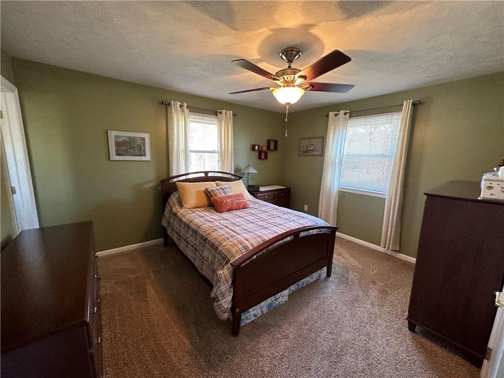 3048 Warren Road Indiana, PA 15701 - Photo 6 of 11 a bedroom with a bed and a flat tv screen on dresser