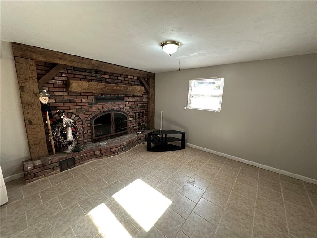 3048 Warren Road Indiana, PA 15701 - Photo 10 of 11 a view of a livingroom with a fireplace and window