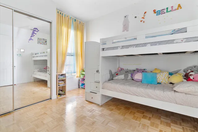 a bedroom with a bed and a cabinets