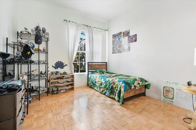 a bedroom with a bed and a couch