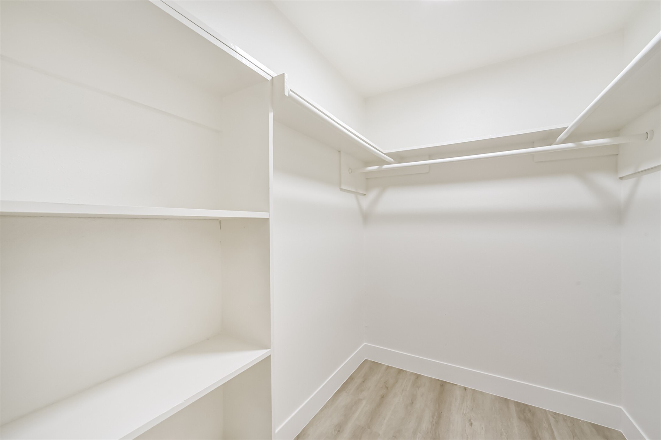 5403 Croix Road Manvel, TX 77578 - Photo 24 of 25 Primary has a walk-in closet with built-in shelving and ample hanging space.