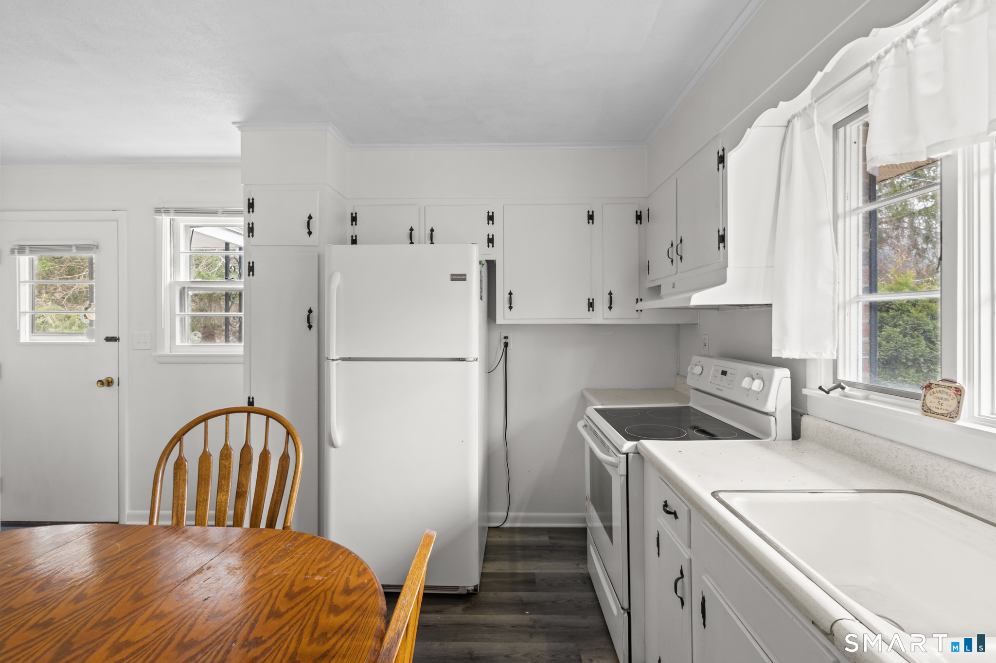 226 Beaumont Highway Lebanon, CT 06249 - Photo 12 of 43 a kitchen with a refrigerator a sink a stove and cabinets