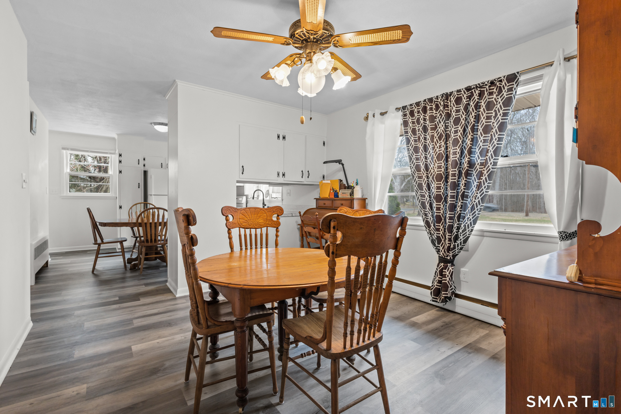 226 Beaumont Highway Lebanon, CT 06249 - Photo 13 of 43 a view of a dining room with furniture window and wooden floor