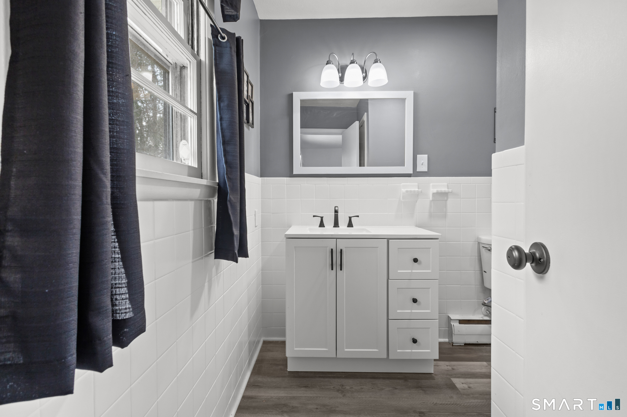 226 Beaumont Highway Lebanon, CT 06249 - Photo 22 of 43 a bathroom with a sink and a mirror