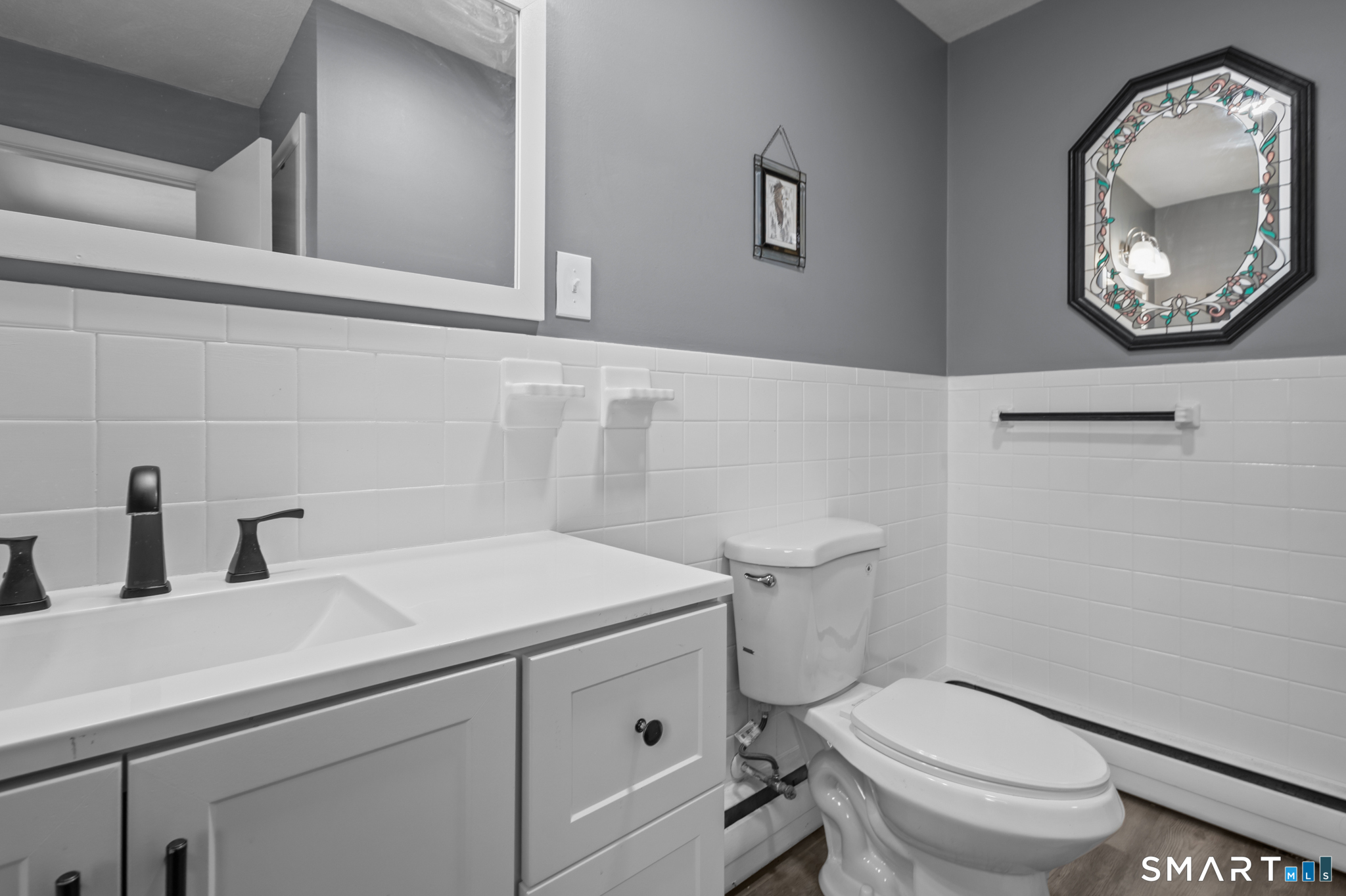 226 Beaumont Highway Lebanon, CT 06249 - Photo 23 of 43 a bathroom with a toilet a sink and mirror