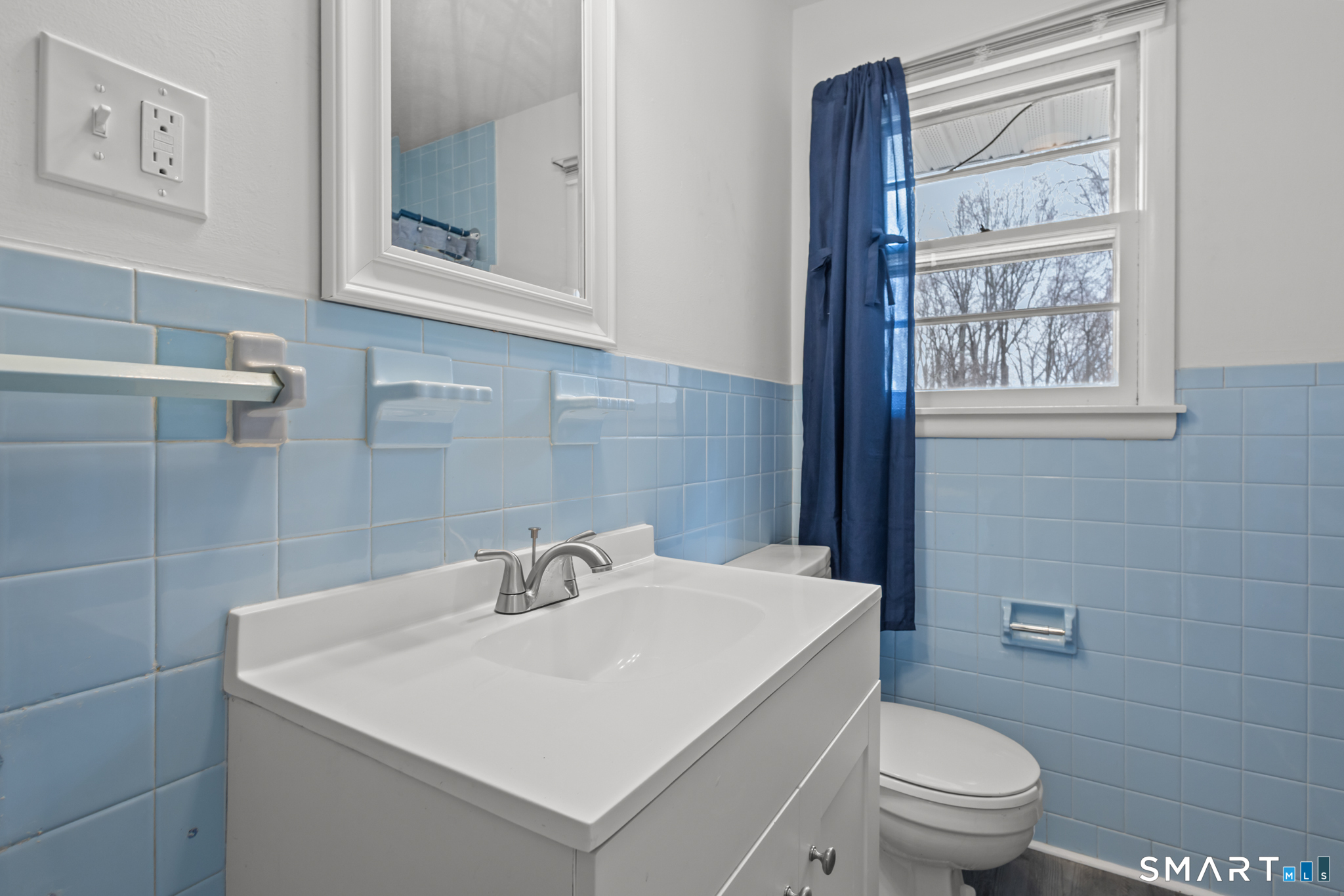 226 Beaumont Highway Lebanon, CT 06249 - Photo 25 of 43 a bathroom with a sink a toilet and mirror